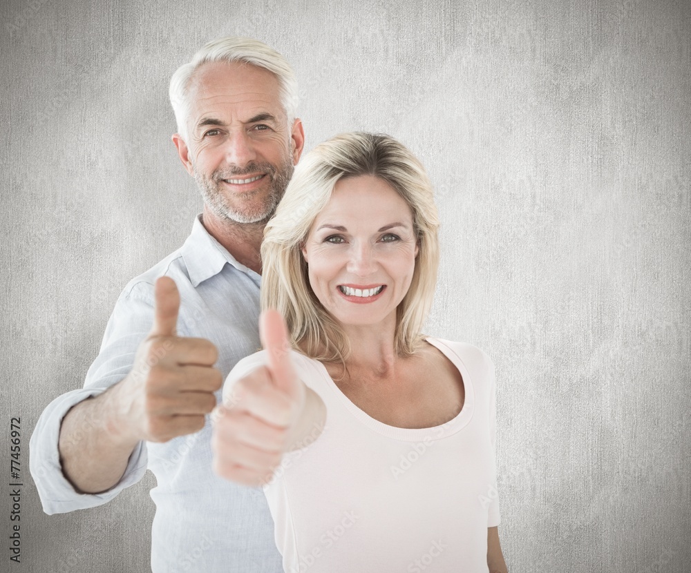 Aufkleber composite image of smiling couple showing thumbs up together