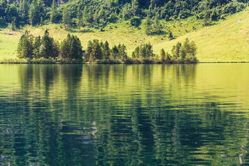 Konigssee lake with clear green water and reflection