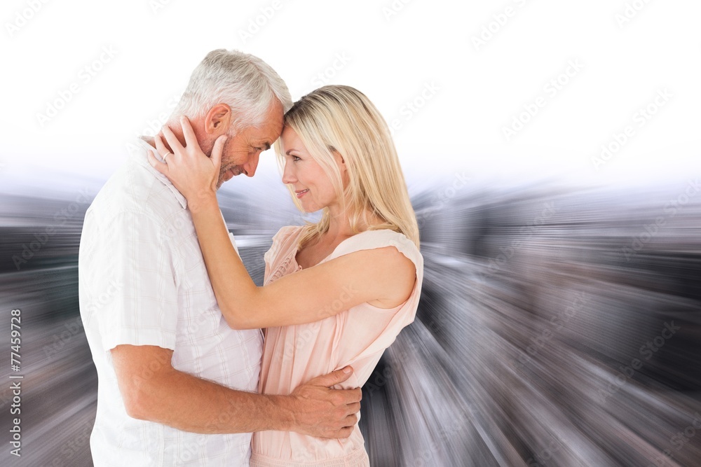 Poster Composite image of affectionate couple standing and hugging