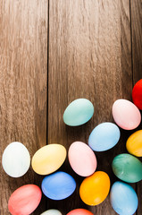 Easter eggs on wooden table background with copy space