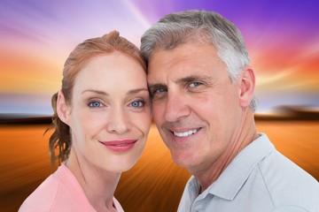 Composite image of casual couple smiling at camera