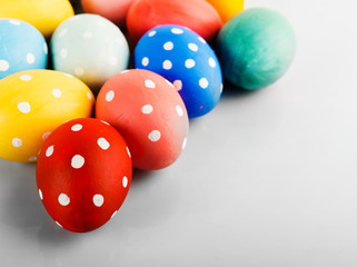 Easter eggs painted in pastel colors on a white background