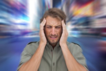 Composite image of man with headache