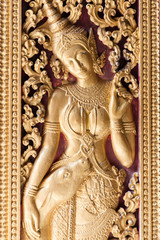 Religious carvings on the doors, Luang Prabang