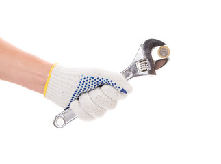 Hand holding adjustable wrench.