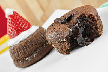 Chocolate cake with strawberry in the shape of hat Christmas