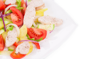 Warm meat salad with vegetables.