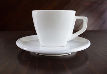 white cup of coffee on table