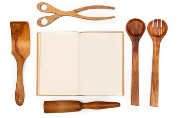 Wooden kitchen utensils and recipe book
