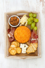 cheese with meat, grape and nuts
