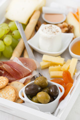 olives with fresh cheese, honey, nuts and grape