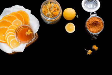 Lemon, honey and spices on black