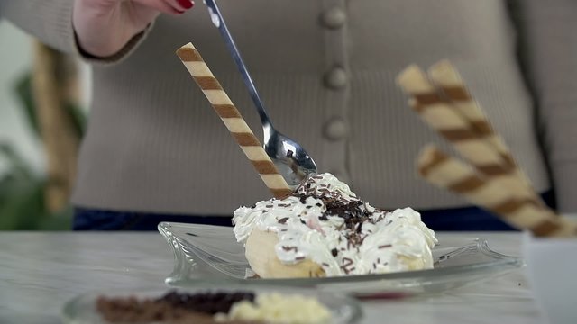 Trying out the ice cream with a spoon for desserts