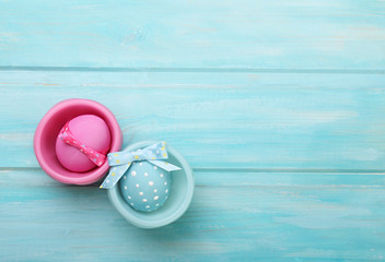 Fototapeta na wymiar Easter pink and blue eggs with bunny ears