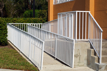 handicap ramp with white railing