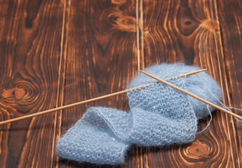 Yarn Balls. Knit Needles. Wooden Table