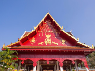 Fototapeta premium Northern Thai art roof in Thai temple under blue sky