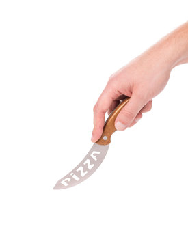 Hand holds pizza's knife.