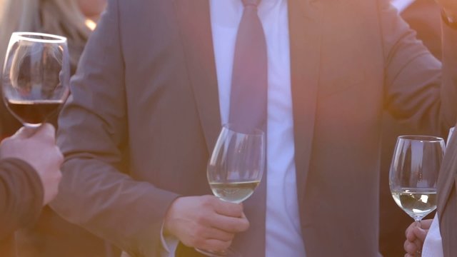 Businessmen talk to each other and gesticulate with their hands