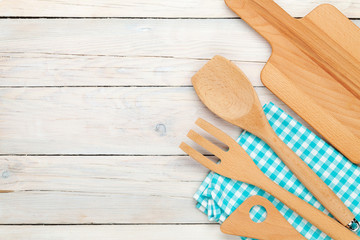 Kitchen utensil over wooden table