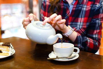 female hands poured green tea close-up