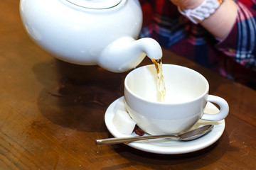 female hands poured green tea close-up