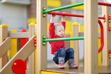 Little girl having fun at a playground