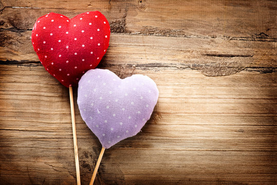 Valentines vintage handmade hearts over wooden background
