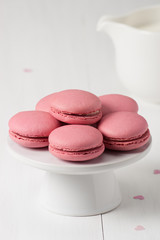 Macaroons Biscuits On White Stand. Paper Hearts