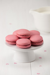 Macaroons Biscuits On White Stand. Paper Hearts