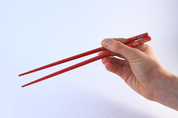 Baguettes chinoises rouges tenues - Red chopsticks