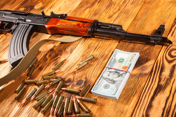 Kalashnikov ammunition and US dollars - 77486713