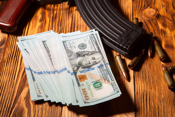 Kalashnikov ammunition and US dollars - 77486749