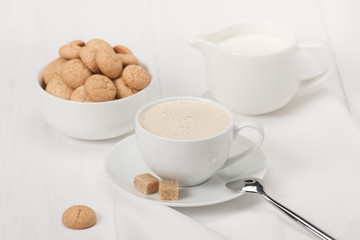 Amaretti Biscuits. Cup Of Cappuccino Coffee. Lump Demerara Sugar