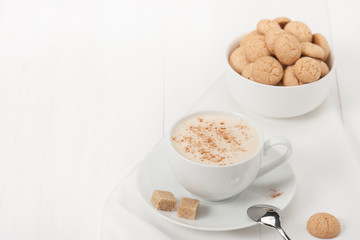 Amaretti Biscuits. Cup Of Cappuccino Coffee. Lump Demerara Sugar