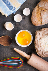 Baking background with bread, eggshell, flour, rolling pin
