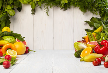 Fototapety  Fruit and vegetable borders on white wooden old table