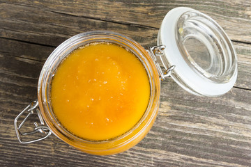 Honey jar on old wooden table