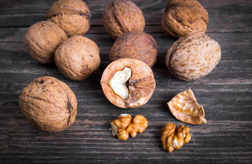 Walnuts on old wooden background