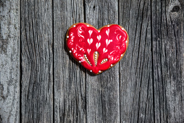 Heart cookie on wood background