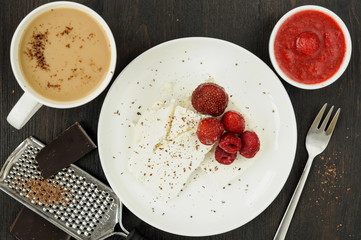Cottage cheese with fresh berries and coffee with milk for break