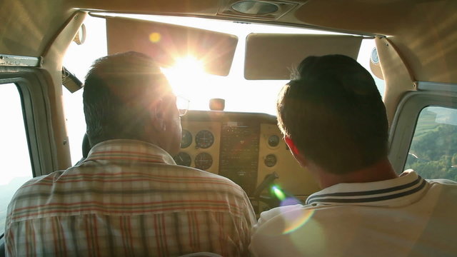 Airplane in air with pilot and copilot