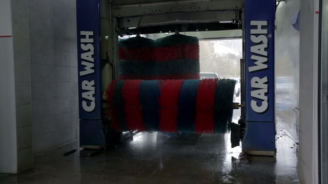 Carwash brushes in the process of washing a car