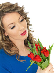Young Woman Holding a Bunch of Tulips