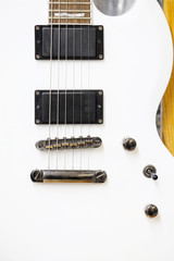 The image of white electric guitar under the white background