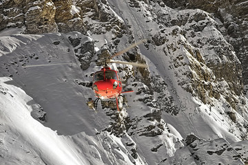 Red helicopter at swiss alps