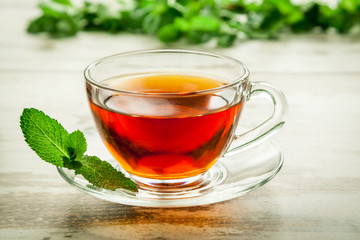 Cup of tea with mint leaves.