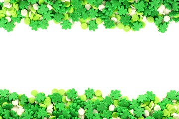St Patricks Day frame of green shamrock candy sprinkles