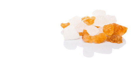 White rock sugar and sugar cane rock over white background
