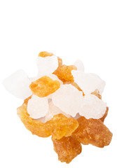 White rock sugar and sugar cane rock over white background